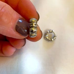 Silver tone huggie earrings with tiny crystals.